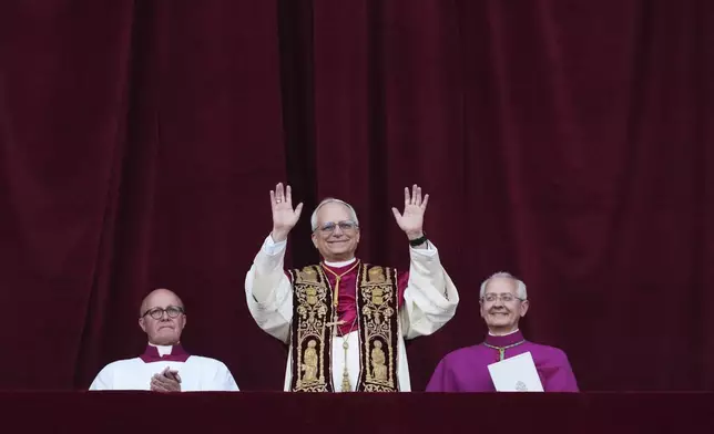 Newly elected Pope Leo XIV appears at the balcony of St. Peter's Basilica at the Vatican, Thursday, May 8, 2025. (AP Photo/Alessandra Tarantino)