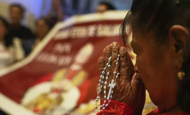 A parishioner prays during Mass at the Santa Maria Cathedral, the episcopal see of the Diocese of Chiclayo, Peru, where newly elected Pope Leo XIV served as bishop, Thursday, May 8, 2025. (AP Photo/Guadalupe Pardo)