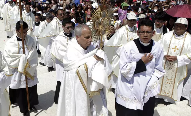 Pope Leo XIV, then Apostolic Administrator of Chiclayo Robert Prevost, attends a Corpus Christi celebration at a stadium in Chiclayo, Peru, Friday, June 19, 2015. (AP Photo/Julio Reano)