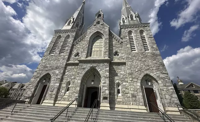 The bell rings out at St. Thomas Church of Villanova at Villanova University in Pennsylvania on Thursday, May 8, 2025, after news broke that one of their alumni, Robert Prevost, had just been elected Pope. (AP Photo/Tassanee Vejpongsa)