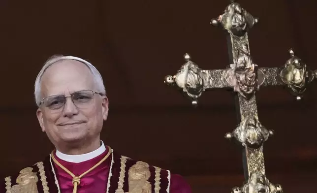 Newly elected Pope Leo XIV appears at the balcony of St. Peter's Basilica at the Vatican, Thursday, May 8, 2025. (AP Photo/Alessandra Tarantino)
