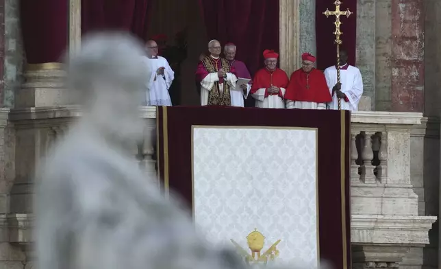Pope Leo XIV appears on the balcony of St Peter's Basilica after his election, at the Vatican, Thursday, May 8, 2025. (AP Photo/Antonio Calanni)