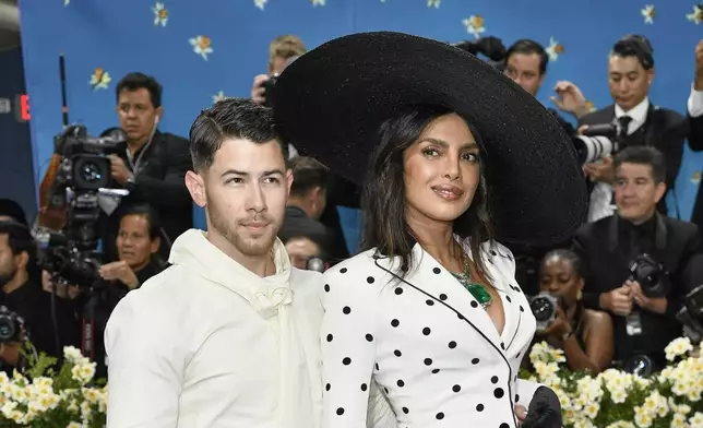 Nick Jonas, left, and Priyanka Chopra attend The Metropolitan Museum of Art's Costume Institute benefit gala celebrating the opening of the "Superfine: Tailoring Black Style" exhibition on Monday, May 5, 2025, in New York. (Photo by Evan Agostini/Invision/AP)