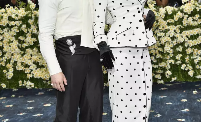Nick Jonas, left, and Priyanka Chopra attend The Metropolitan Museum of Art's Costume Institute benefit gala celebrating the opening of the "Superfine: Tailoring Black Style" exhibition on Monday, May 5, 2025, in New York. (Photo by Evan Agostini/Invision/AP)