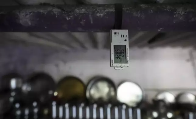 A device that tracks the temperature and other data is tied to the roof of a home in Vanzara Vas, a low-income neighborhood, in Ahmedabad, India, Wednesday, April 2, 2025. (AP Photo/Ajit Solanki)