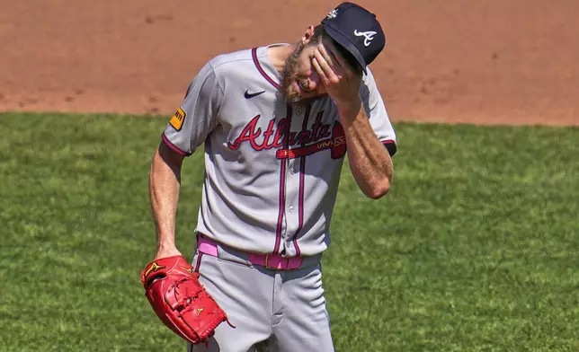Atlanta Braves pitcher Chris Sale collects himself between batters during the fifth inning of a baseball game against the Pittsburgh Pirates in Pittsburgh, Sunday, May 11, 2025. (AP Photo/Gene J. Puskar)