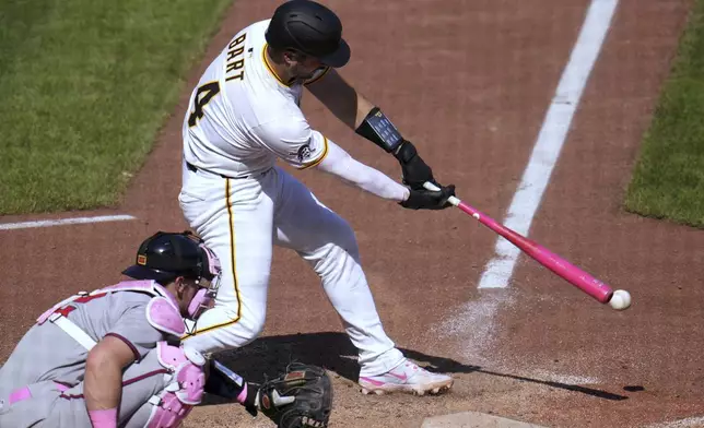 Pittsburgh Pirates' Joey Bart singles off Atlanta Braves pitcher Raisel Iglesias, driving in the winning run, during the bottom of the ninth inning of a baseball game in Pittsburgh, Sunday, May 11, 2025. (AP Photo/Gene J. Puskar)