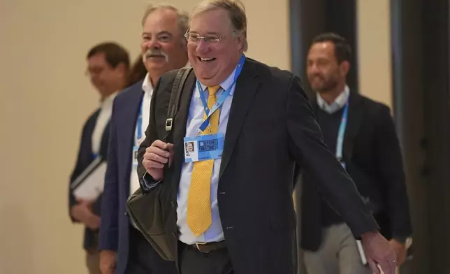 New Orleans Saints president Dennis Lauscha, front, arrives ahead of an NFL football owners meeting, Tuesday, May 20, 2025, in Eagan, Minn. (AP Photo/Abbie Parr)