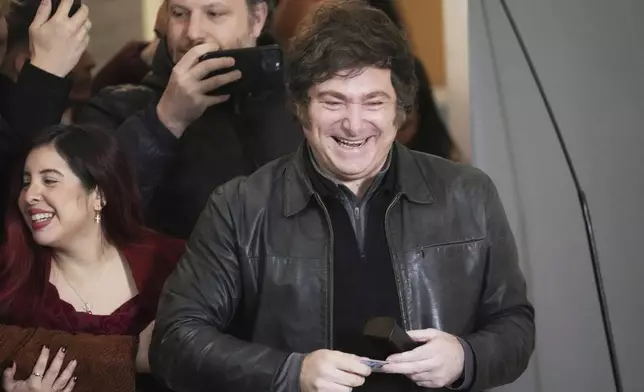 Argentina's President Javier Milei arrives to vote in city legislatures elections in Buenos Aires, Argentina Sunday, May 18, 2025. (AP Photo/Rodrigo Abd)