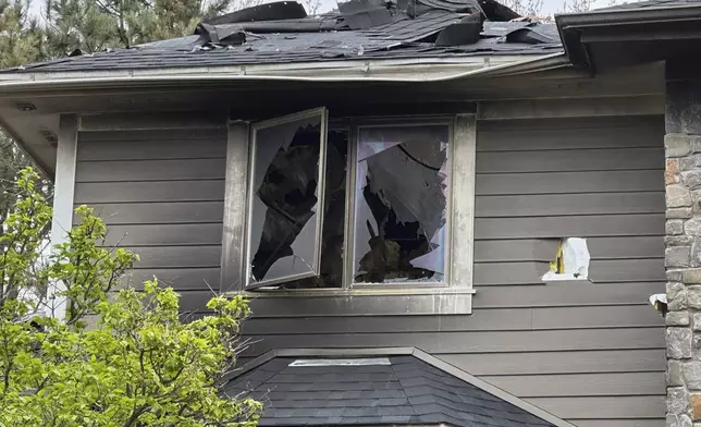 The home of Jill Sobule showed heavy damage on Friday, May 2, 2025, in Woodbury, Minn., a day after a fire engulfed the house, killing the 66-year-old singer-songwriter. (AP Photo/Amy Forliti)