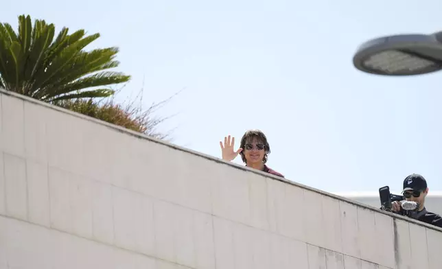 Tom Cruise arrives for the photo call for the film 'Mission: Impossible – The Final Reckoning' at the 78th international film festival, Cannes, southern France, Wednesday, May 14, 2025. (AP Photo/Natacha Pisarenko)