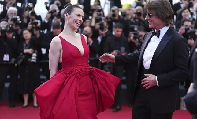 Hayley Atwell, left, and Tom Cruise pose for photographers upon arrival at the premiere of the film 'Mission: Impossible - The Final Reckoning' at the 78th international film festival, Cannes, southern France, Wednesday, May 14, 2025. (Photo by Scott A Garfitt/Invision/AP)