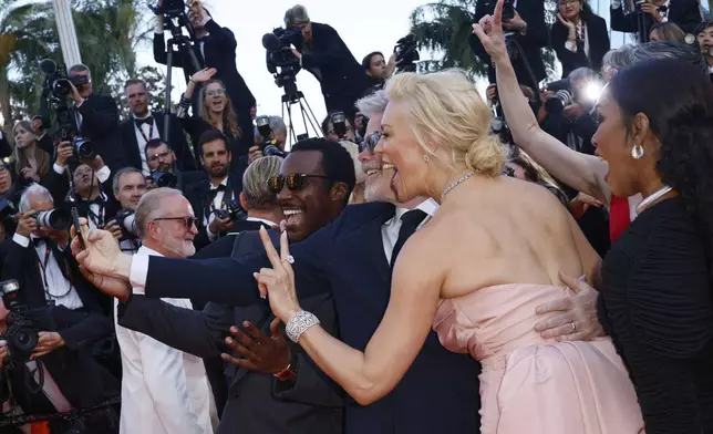 Tramell Tillman, from left, director Christopher McQuarrie, Hannah Waddingham, and Angela Bassett take a selfie upon arrival for the premiere of the film 'Mission: Impossible - The Final Reckoning' at the 78th international film festival, Cannes, southern France, Wednesday, May 14, 2025. (Photo by Joel C Ryan/Invision/AP)