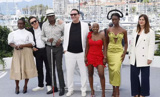 Aissa Maiga, from left, Mohamed Grayaa, Toure Blamassi, Foued Zaazaa, Deborah Christelle Lobe Naney, Laetitia Ky and Didar Domehri pose for photographers at the photo call for the film 'Promised Sky' at the 78th international film festival, Cannes, southern France, Wednesday, May 14, 2025. (Photo by Joel C Ryan/Invision/AP)