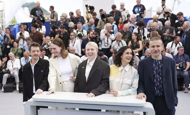Jury president Molly Manning Walker, centre, and jury members Nahuel Perez Biscayart, from left, Vanja Kaludjercic, Louise Courvoisier, and Roberto Minervini pose for photographers at the photo call for the Un Certain Regard jury at the 78th international film festival, Cannes, southern France, Wednesday, May 14, 2025. (Photo by Scott A Garfitt/Invision/AP)