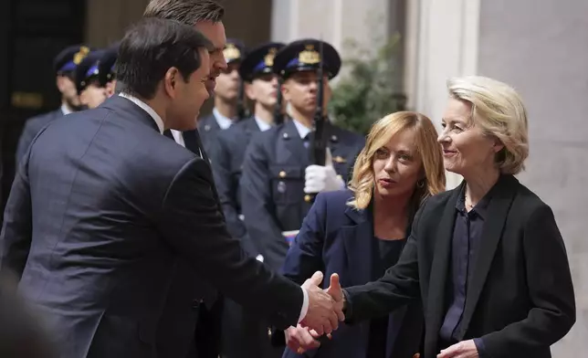 Secretary of State Marco Rubio, from left, Vice President JD Vance, Italy's Prime Minister Giorgia Meloni and European Commission President Ursula von der Leyen greet each other as they arrive for a meeting at the Chigi Palace in Rome, Italy, Sunday, May 18, 2025. (AP Photo/Jacquelyn Martin, Pool)