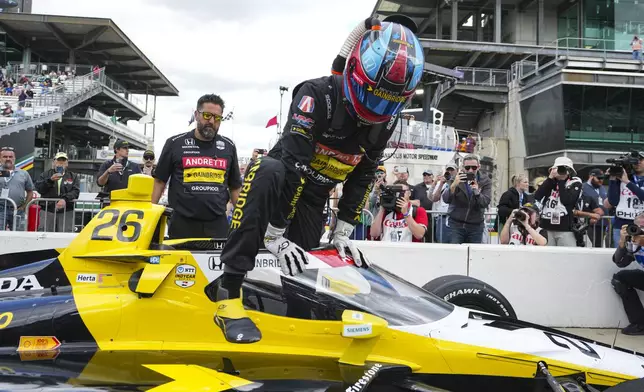 Colton Herta prepares climbs out of his car during qualifications for the Indianapolis 500 auto race at Indianapolis Motor Speedway in Indianapolis, Saturday, May 17, 2025. (AP Photo/Michael Conroy)