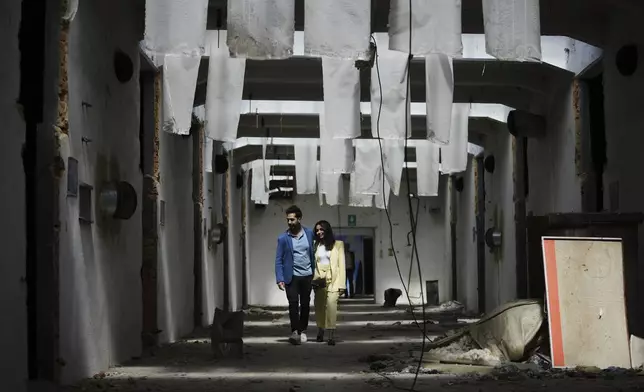 Visitors observe the Museum of Survivors, located in a factory where Oskar Schindler saved some 1200 Jews during the WWII, in Brnenec, Czech Republic, Saturday, May 10, 2025. (AP Photo/Petr David Josek)