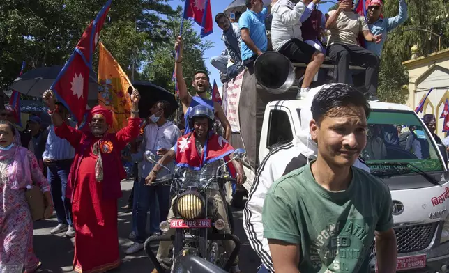 Pro-monarchy supporters take part in a rally calling for the restoration of Nepal's monarchy in Kathmandu, Nepal, Thursday, May 29, 2025. (AP Photo/Niranjan Shrestha)