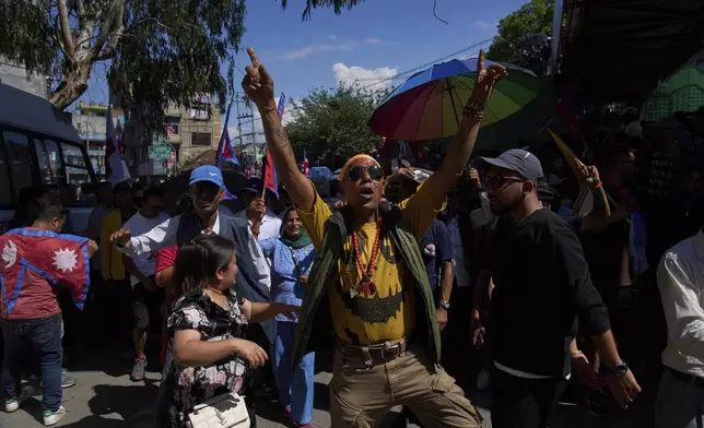 Pro-monarchy supporters take part in a rally calling for the restoration of Nepal's monarchy in Kathmandu, Nepal, Thursday, May 29, 2025. (AP Photo/Niranjan Shrestha)