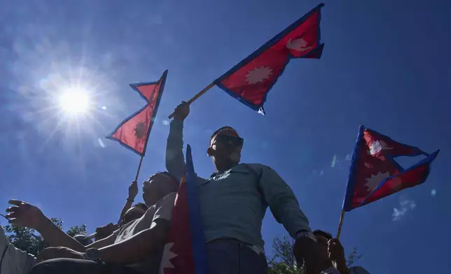 Pro-monarchy supporters take part in a rally calling for the restoration of Nepal's monarchy in Kathmandu, Nepal, Thursday, May 29, 2025. (AP Photo/Niranjan Shrestha)