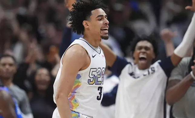 Denver Nuggets guard Julian Strawther reacts after hitting a 3-point basket late in the second half of Game 6 in the Western Conference semifinals of the NBA basketball playoffs against the Oklahoma City Thunder Thursday, May 15, 2025, in Denver. (AP Photo/David Zalubowski)