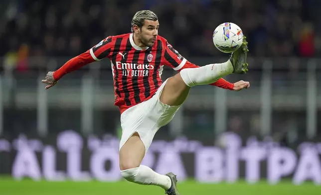 AC Milan's Theo Hernandez leaps to control the ball during the Serie A soccer match between Milan and Bologna at San Siro Stadium in Milan, Italy, Friday May 9, 2025. (Spada/LaPresse via AP)