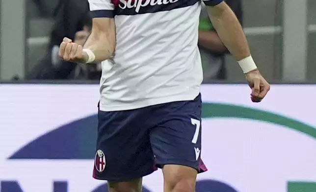Bologna's Riccardo Orsolini celebrates after scoring during the Serie A soccer match between Milan and Bologna at San Siro Stadium in Milan, Italy, Friday May 9, 2025. (Spada/LaPresse via AP)