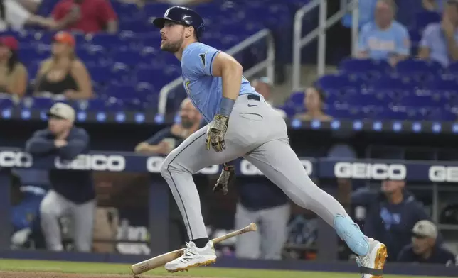Tampa Bay Rays' Brandon Lowe hits a double to center field during the first inning of a baseball game against the Miami Marlins, Saturday, May 17, 2025, in Miami. (AP Photo/Marta Lavandier)