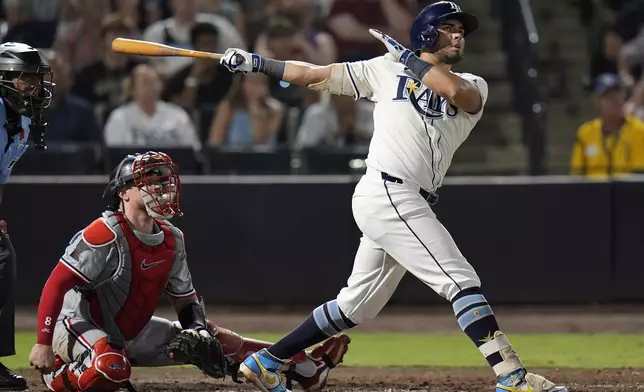 Tampa Bay Rays' Jonathan Aranda watches his three-run home run off Minnesota Twins pitcher Brock Stewart during the sixth inning of a baseball game Monday, May 26, 2025, in Tampa, Fla. (AP Photo/Chris O'Meara)