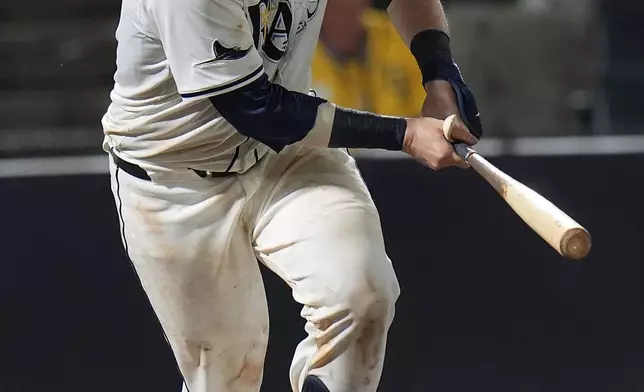 Tampa Bay Rays' Danny Jansen watches his two-run home run off Minnesota Twins pitcher Kody Funderburk during the eighth inning of a baseball game Monday, May 26, 2025, in Tampa, Fla. (AP Photo/Chris O'Meara)