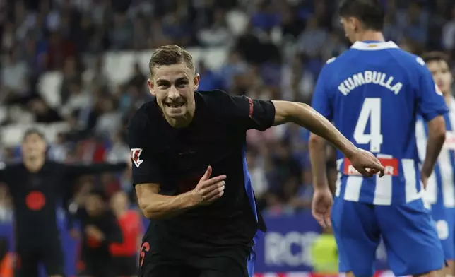 Barcelona's Fermin Lopez celebrates after scoring his side's second goal during a Spanish La Liga soccer match between Barcelona and Espanyol at Lluis Companys Olympic Stadium in Barcelona, Spain, Thursday, May 15, 2025. (AP Photo/Joan Monfort)