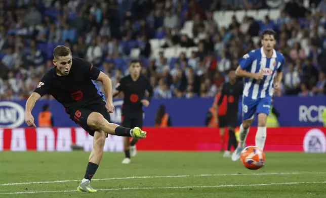 Barcelona's Fermin Lopez scores his side's second goal during a Spanish La Liga soccer match between Barcelona and Espanyol at Lluis Companys Olympic Stadium in Barcelona, Spain, Thursday, May 15, 2025. (AP Photo/Joan Monfort)