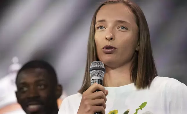 Title holder Iga Swiatek, of Poland, speaks during the draw of French Open tennis tournament, Thursday, May 22, 2025 at the Roland Garros stadium in Paris. (AP Photo/Christophe Ena)