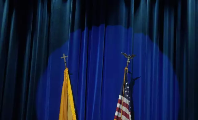 The U.S. and Vatican flags are displayed at the North American College in Rome, Friday, May 9, 2025, for a press conference with U.S. cardinals—one day after U.S. Cardinal Robert Francis Prevost was elected Pope Leo XIV. (AP Photo/Gregorio Borgia)