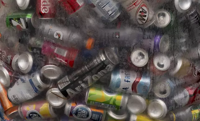 Used beverage containers are seen in a bag outside the Glisan BottleDrop Redemption Center on Thursday, May 15, 2025, in Portland, Ore. (AP Photo/Jenny Kane)