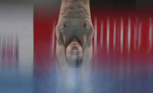 Cheng Zilong of China competes in the Men's 10m Platform event for the Diving World Cup Super Final held at the Water Cube, in Beijing on Sunday, May 4, 2025. (AP Photo/Andy Wong)