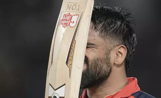 Punjab Kings' Prabhsimran Singh reacts as he walks off the field after losing his wicket during the Indian Premier League cricket match between Lucknow Super Giants and Punjab Kings at Himachal Pradesh Cricket Association Stadium in Dharamshala, India, Sunday, May 4, 2025. (AP Photo/Ashwini Bhatia)