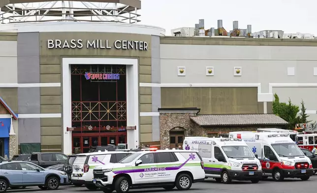 Waterbury police and emergency first responders are at Brass Mill Center, where several people were shot on Tuesday afternoon, May 27, 2025, in Waterbury, Conn. (Jim Shannon/Hearst Connecticut Media via AP)