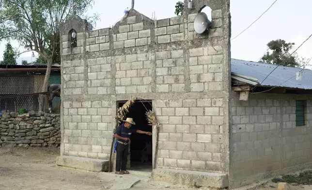 Deacon Juan Pérez Gómez arrives to the local Catholic chapel in Constitución, near Simojovel, Mexico, Saturday, April 26, 2025. (AP Photo/Isabel Mateos)