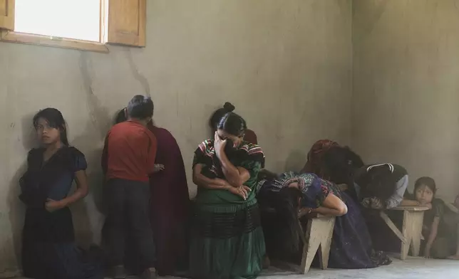 FILE - Indigenous women kneel in prayer during a memorial Mass honoring the late Pope Francis, in the Simojovel municipality, Mexico, April 27, 2025. (AP Photo/Isabel Mateos, File)