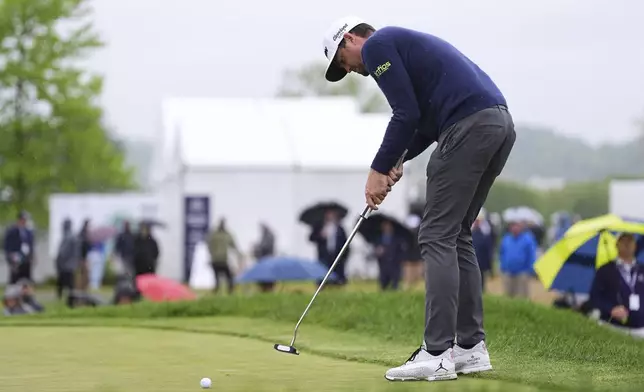 Keegan Bradley putts on the tenth hole during the second round of the Truist Championship golf tournament at the Philadelphia Cricket Club, Friday, May 9, 2025, in Flourtown. (AP Photo/Matt Rourke)