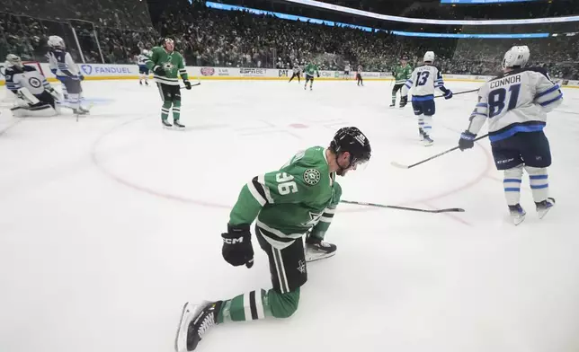 Dallas Stars' Mikko Rantanen (96) celebrates his goal in the third period of Game 3 of a second-round NHL hockey playoff series against the Winnipeg Jets in Dallas, Sunday, May 11, 2025. (AP Photo/Julio Cortez)