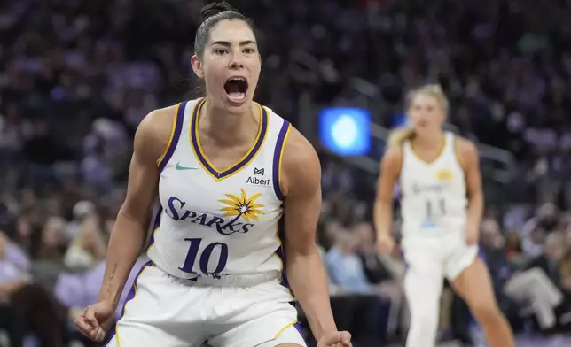 Los Angeles Sparks guard Kelsey Plum (10) celebrates after scoring against the Golden State Valkyries during the second half of a WNBA basketball game in San Francisco, Friday, May 16, 2025. (AP Photo/Jeff Chiu)