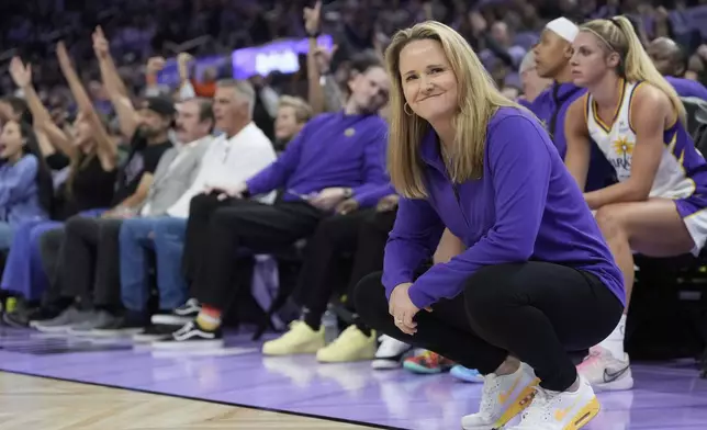 Los Angeles Sparks head coach Lynne Roberts, foreground, reacts after a score by Golden State Valkyries' Julie Vanloo during the first half of a WNBA basketball game in San Francisco, Friday, May 16, 2025. (AP Photo/Jeff Chiu)