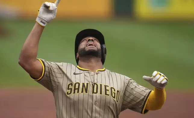 San Diego Padres' Elias Díaz celebrates as he crosses home plate after hitting a solo home run off Pittsburgh Pirates pitcher Andrew Heaney during the second inning of a baseball game in Pittsburgh, Sunday, May 4, 2025. (AP Photo/Gene J. Puskar)