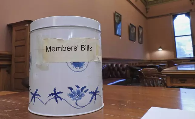 The decorative cookie tin, known in New Zealand as the biscuit tin, which was purchased from a department store in the early 1990s to draw lawmakers' bills from and remains in use, at Parliament in Wellington, New Zealand, Thursday, May 22, 2025. (AP Photo/Charlotte Graham-McLay)