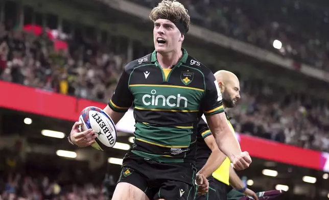 Northampton Saints' Alex Coles celebrates scoring a try during the Investec Champions Cup final between Northampton Saints and Bordeaux-Begles, at the Principality Stadium, Cardiff, Wales, Saturday May 24, 2025. (Adam Davy/PA via AP)