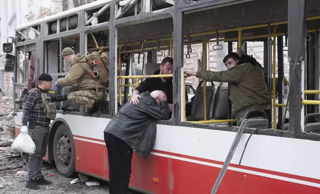 FILE- A man cries at the trolleybus after a Russian missile strike on Sumy, Ukraine, April 13, 2025. (AP Photo/Volodymyr Hordiienko, file)
