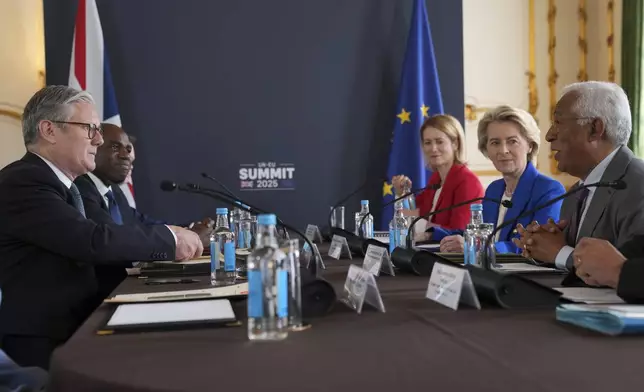Britain's Prime Minister Keir Starmer, left, speaks to European Commission President Ursula von der Leyen, second right, and European Council President Antonio Costa, right, during a meeting between the U.K. and the European Union to discuss closer ties in their first official summit since Brexit, in London, Monday, May 19, 2025.(AP Photo/Kin Cheung, Pool)